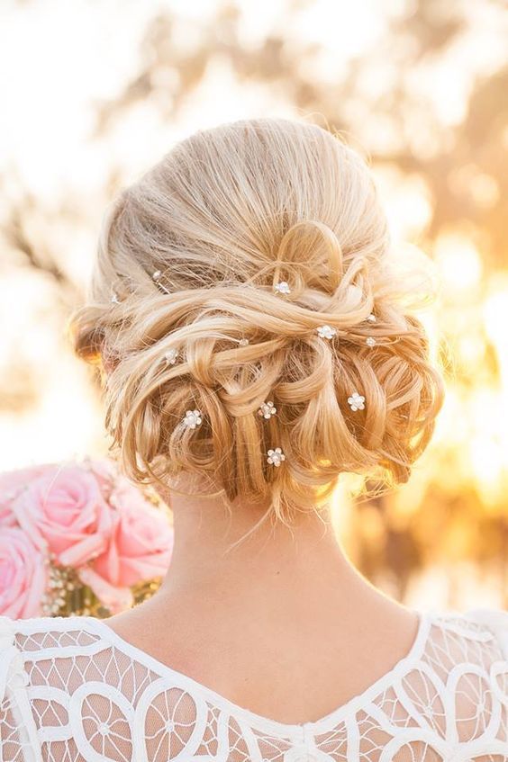 Wedding updo hairstyle idea via Ulyana Aster
