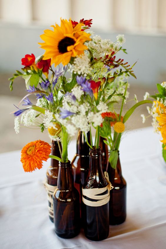 beer bottle vases - for DIY bbq wedding center pieces. wrap with twine or jute