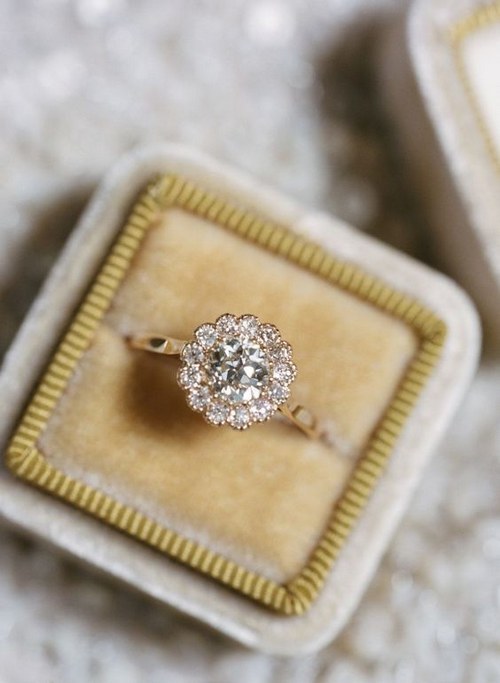 Trend We Love: 20 Floral-Inspired Engagement Rings 15 diamond halo engagement ring via Elisa Bricker