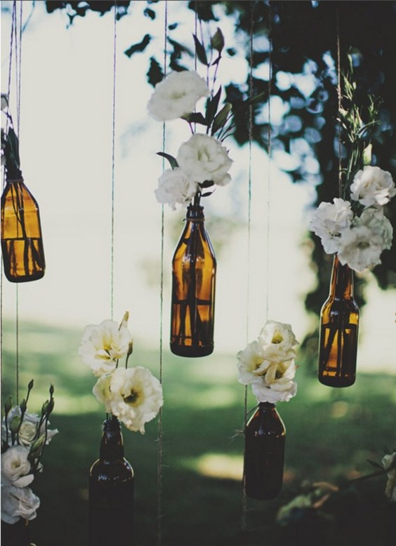 hanging flowers on bottles wedding decor