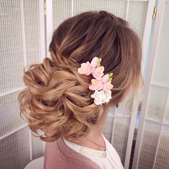 long messy wedding hairstyle upfo with pink flowers via antonina roman