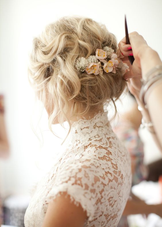 messy wedding hairstyle updo with flowers