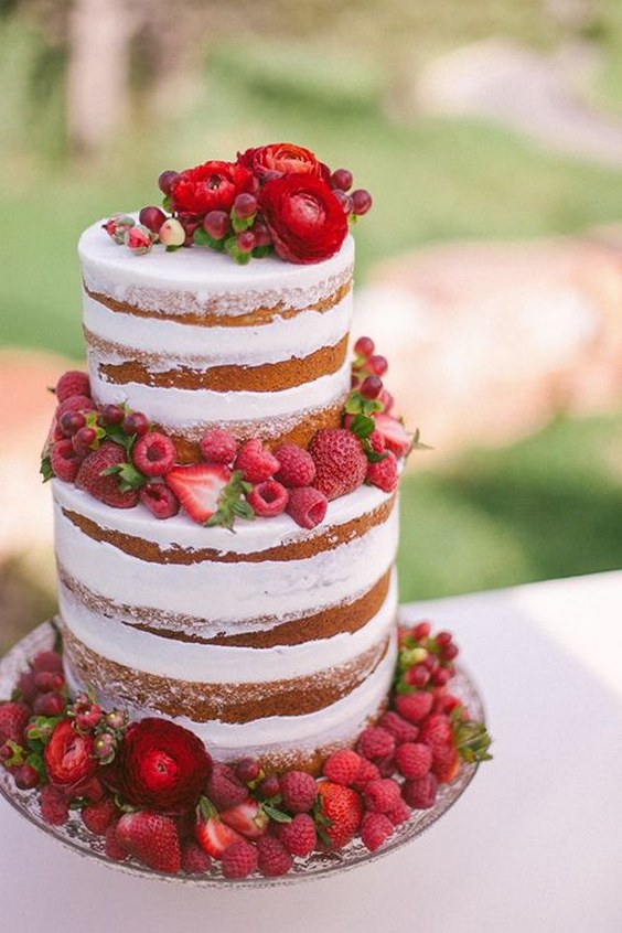 naked wedding cake with fresh raspberries and strawberries