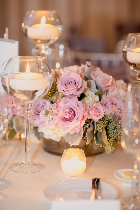 pink flowers and candle wedding centerpiece