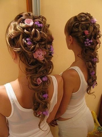 tangled wedding hairstyle with flowers