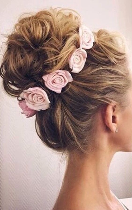 wedding updo hairstyle with pink flowers