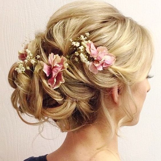 wedding updo hairstyles with pink flowers