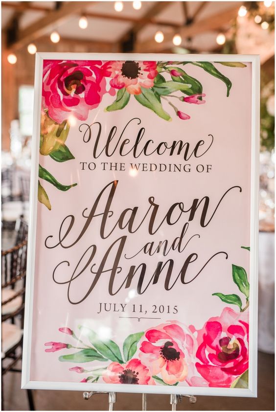 wedding welcome sign at barn reception