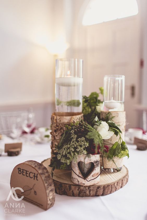 woodland inspired spring wedding, where we brought the outside 'in' with tree-style centrepieces, wood slices, bark wrapped containers