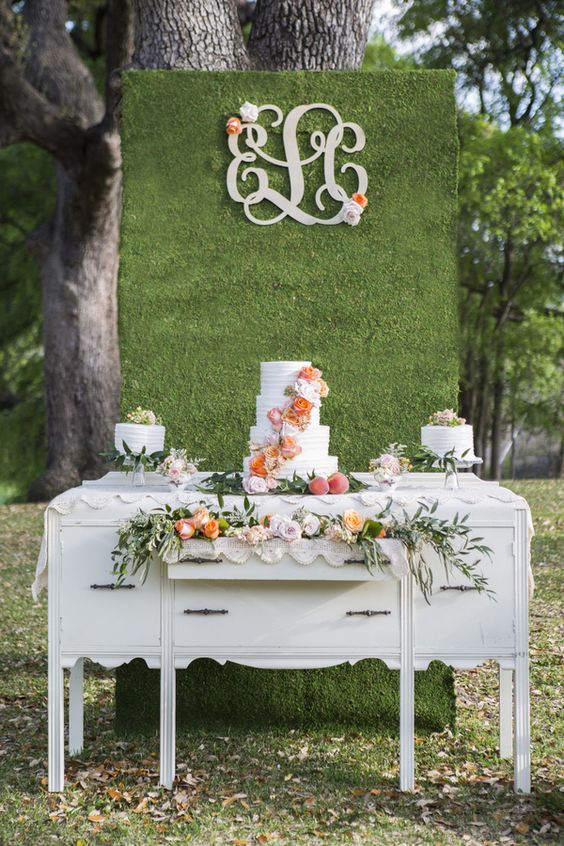 Dessert Display with a Floral Wall and Monogram