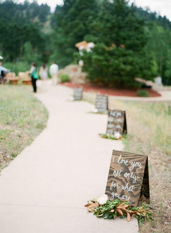 rustic wedding walkway with wedding sign decor