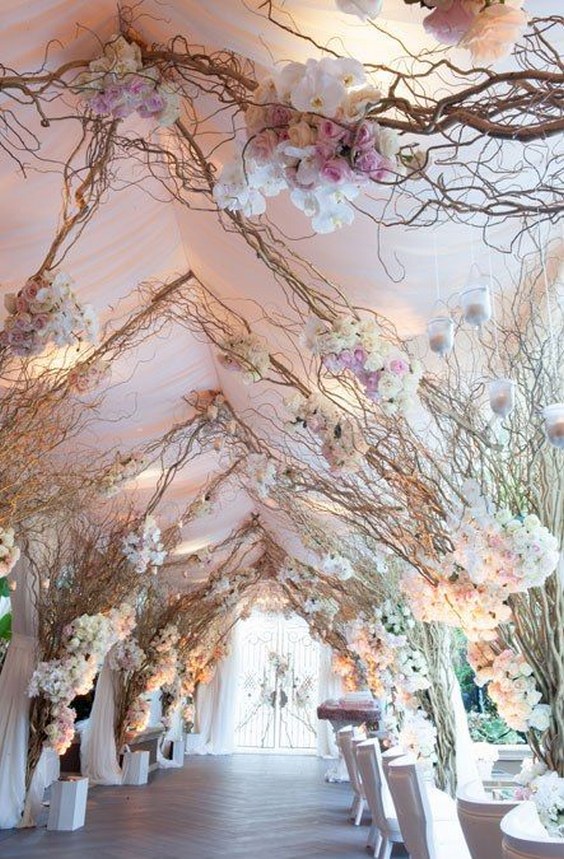 walkway of whimsical branches and blooms