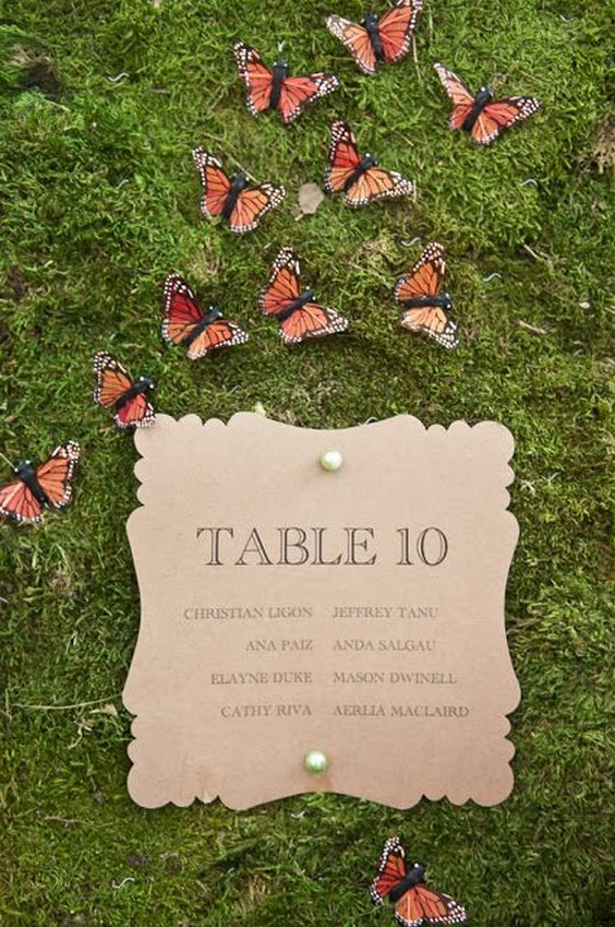 woodland table placements featuring butterflies and moss