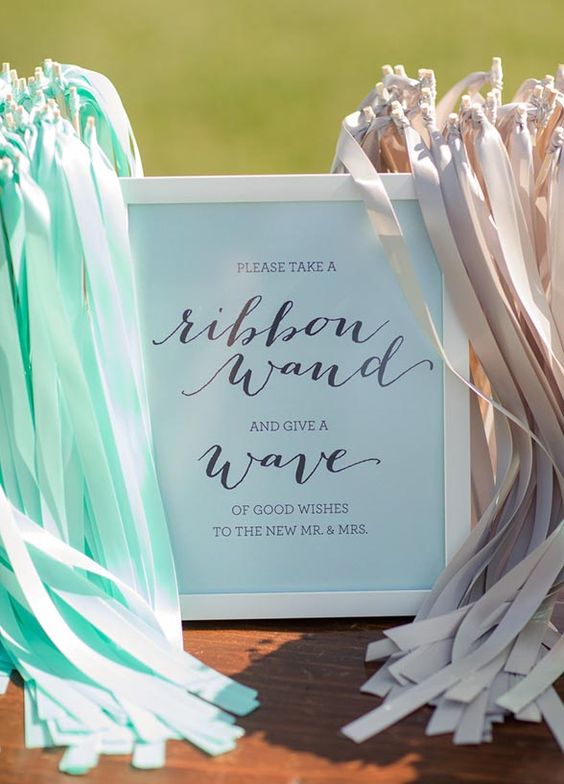 Add a dash of fun and flair to your exit with ribbon wands waving through the air in your wedding colors
