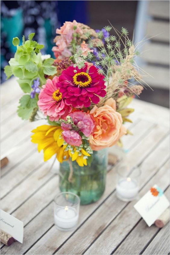 Beautiful bold colored mason jar flower arrangement
