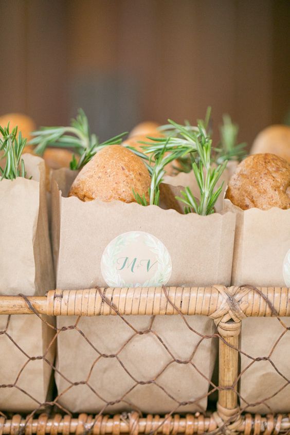 Bread in paper bag with sprig of rosemary