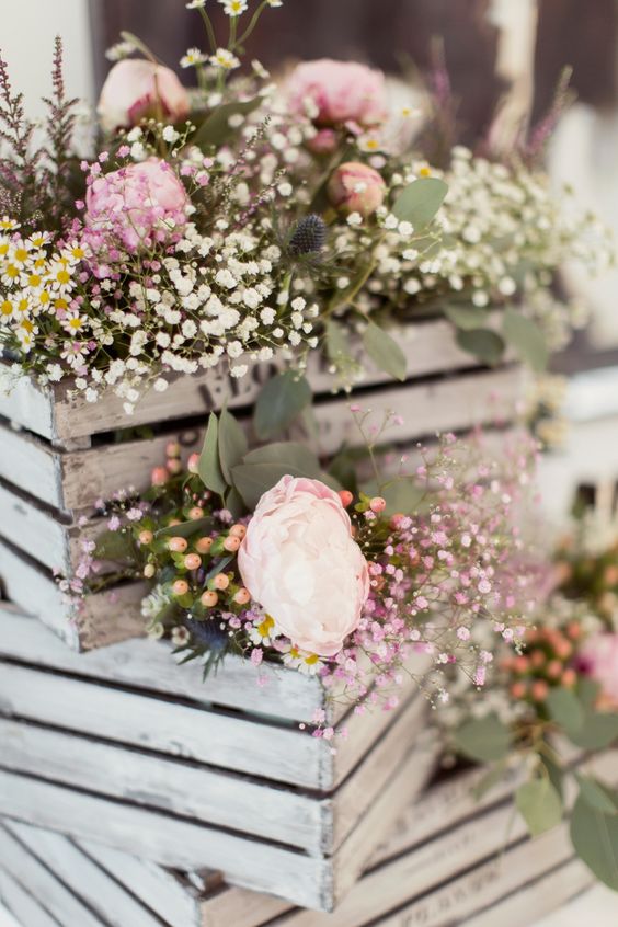 Country garden wedding flowers peonies, gypsophila and thistle wooden crates wedding decor