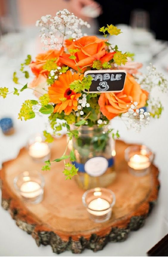 Country orange and white wedding centerpiece