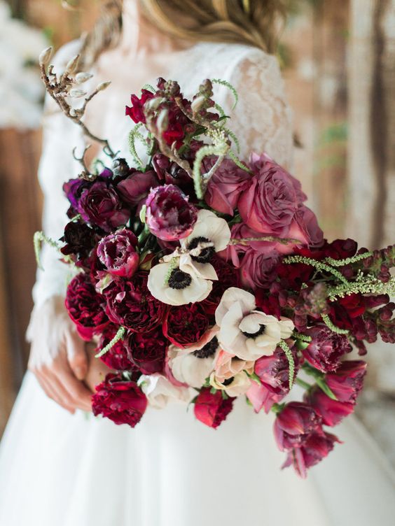Deep pink wedding bouquet with roses, tulips and Anemones
