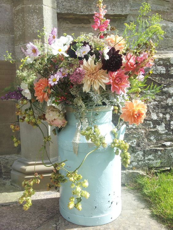 Embracing summer flower churn at church entrance