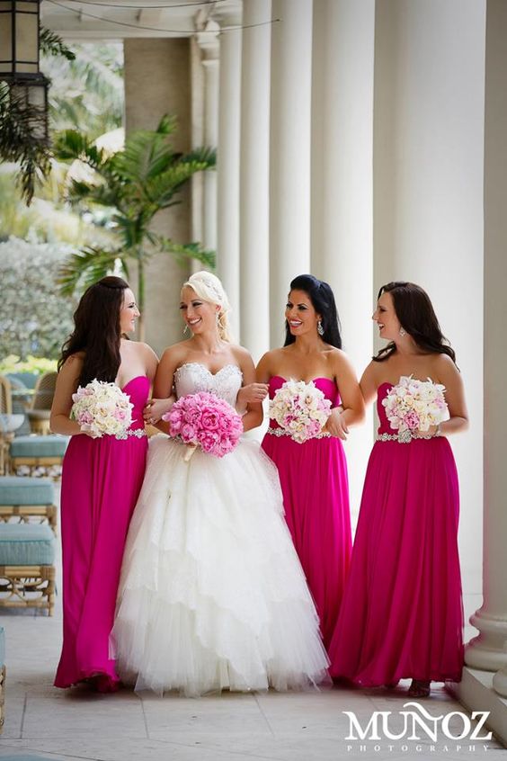 Fuchsia bridesmaid dresses and white bouquet