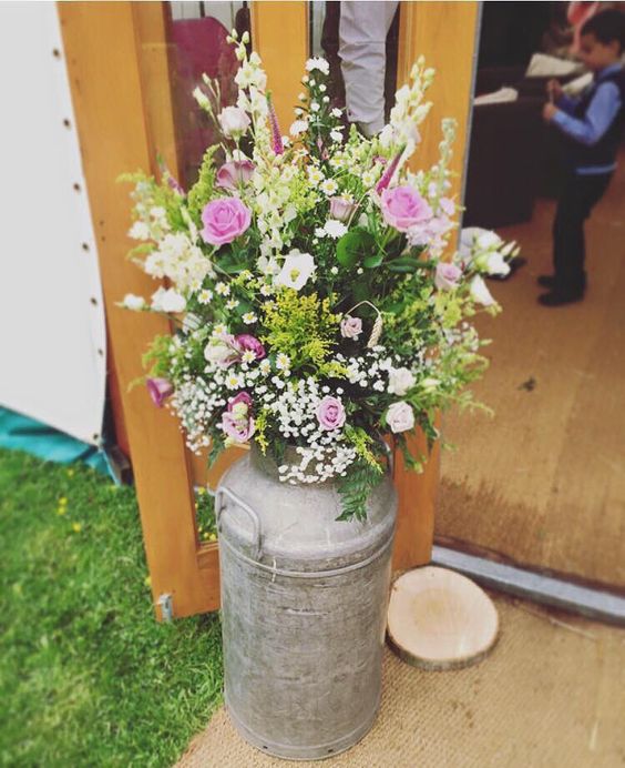 Milk churns country natural wedding arrangement