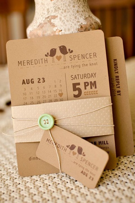 Modern bird themed wedding invitation on rustic kraft paper with mint green button and twine