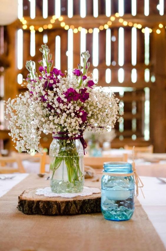 Rustic wedding centerpieces in the barn