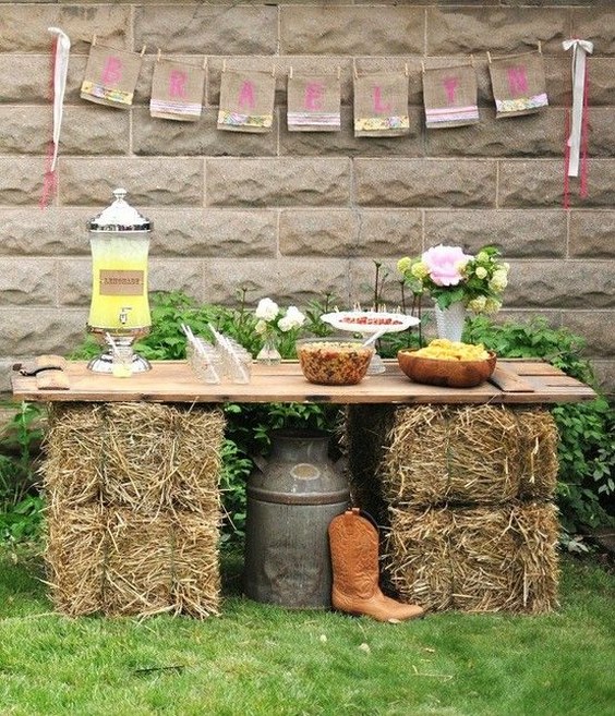 Serve food on hay bales & wooden boards for outdoor cocktail party