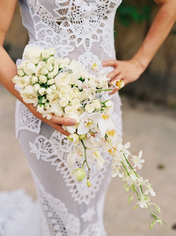 Tropical cream colored wedding bouquet via Cassidy Carson