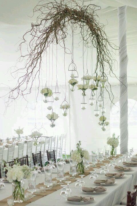Wooden branch wedding arch to hang flowers or lights off above tables, rustic country decorative idea