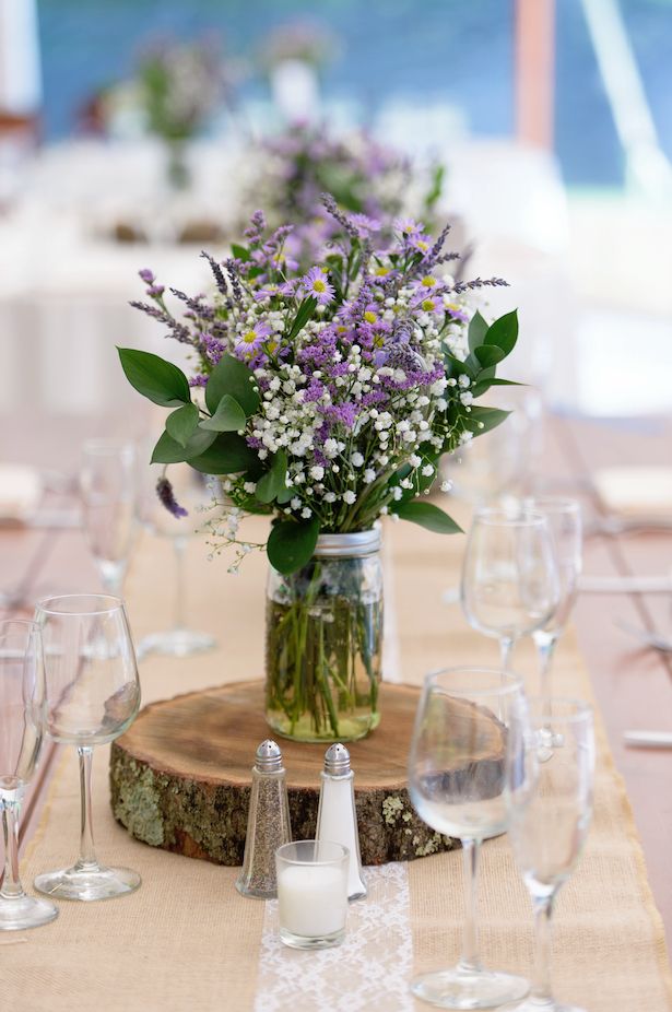 rustic treen stump and mason jar purple flowers