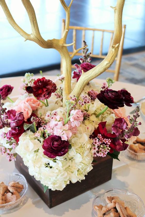 Pink and burgundy centerpiece with gold manzanita