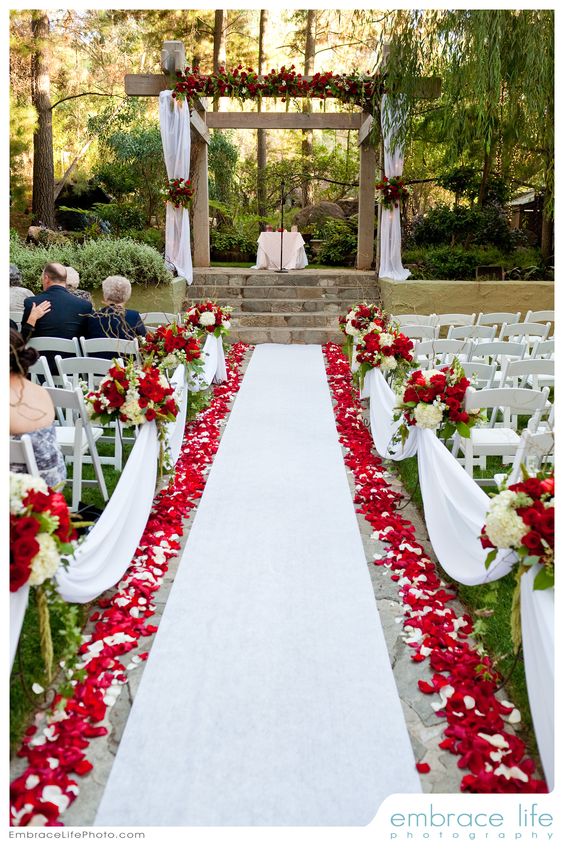 Red and white wedding ceremony flowers