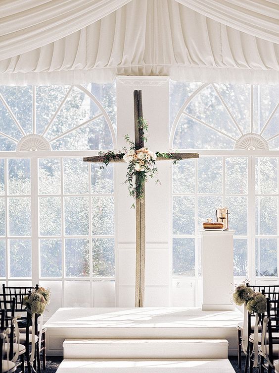 cross backdrop for indoor wedding ceremony