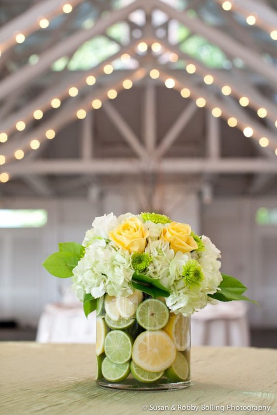 floral wedding centerpiece with lemons and limes