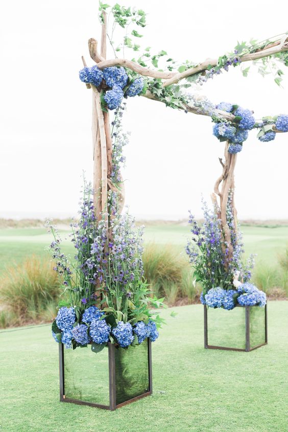 hydrangea adorned driftwood wedding arbor