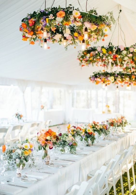 industrial bulbs and orange flowers wedding centerpiece