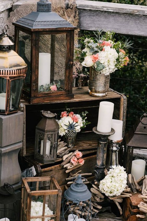 lanterns driftwood crates and candles beach wedding idea