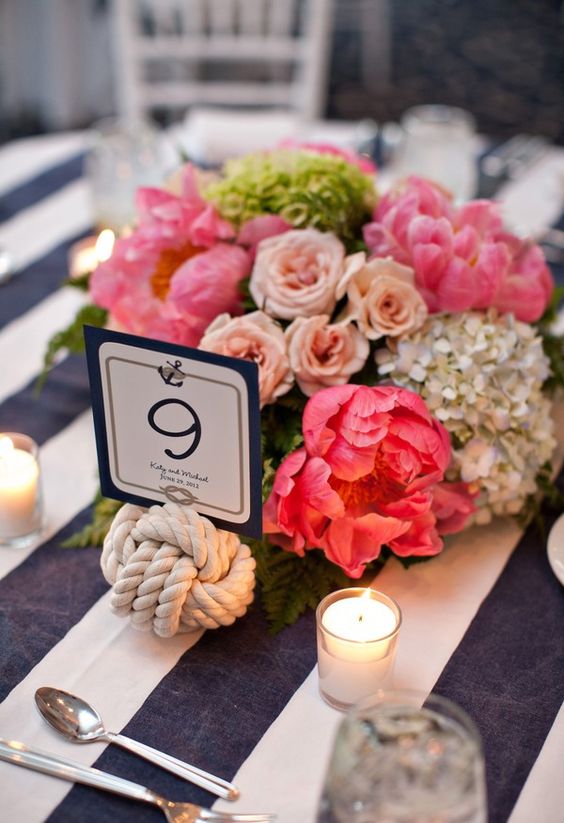 nautical navy white cloth with knot table number and bright florals