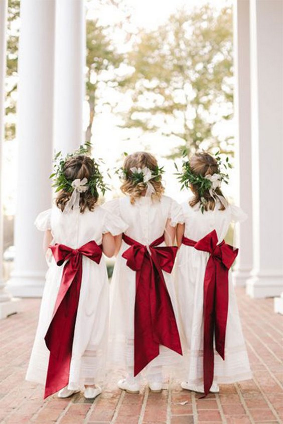 white flower girl dresses with red bow sashes