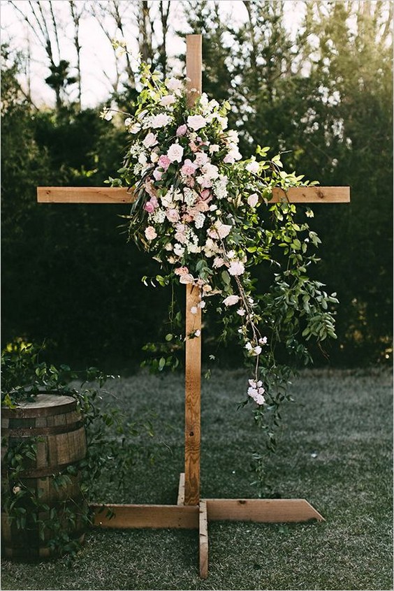 wood cross with flowers wedding backdrop