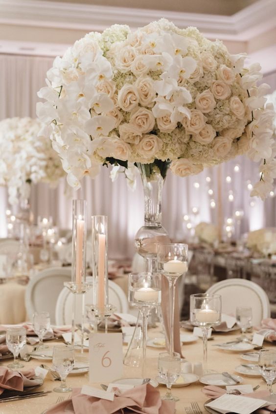 all white tall wedding reception centerpiece idea via jana williams photography