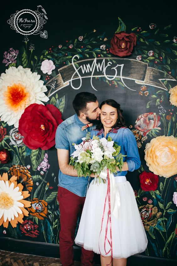 chalkboard and paper flowers wedding backdrop