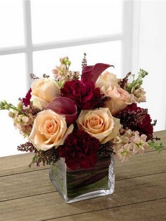 peach and burgundy wedding centerpiece