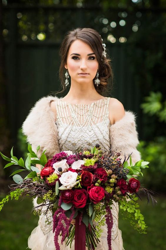 Berry-toned overgrown bouquet and faux fur bridal wrap