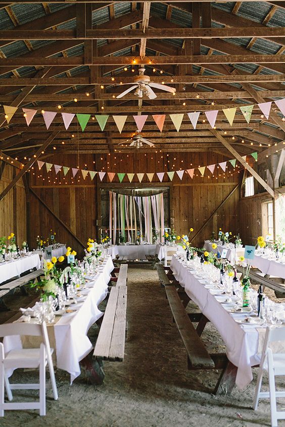 rustic barn wedding reception with bunting details
