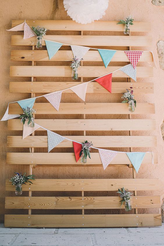 rustic wooden wedding backdrop with bunting