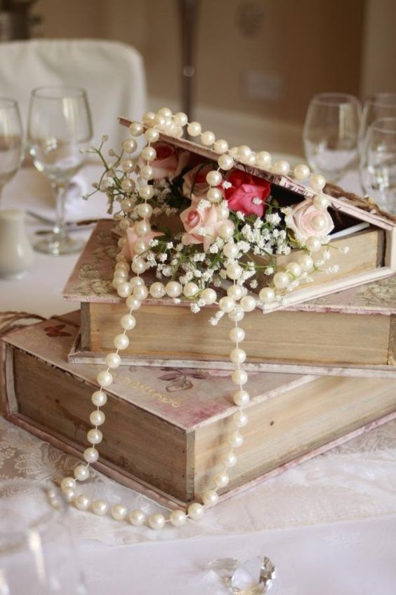 wedding centerpieces with books and pearls