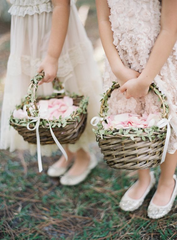 greenery accented woven flower girl baskets